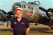 Robert Morgan today, standing in front of a B-17